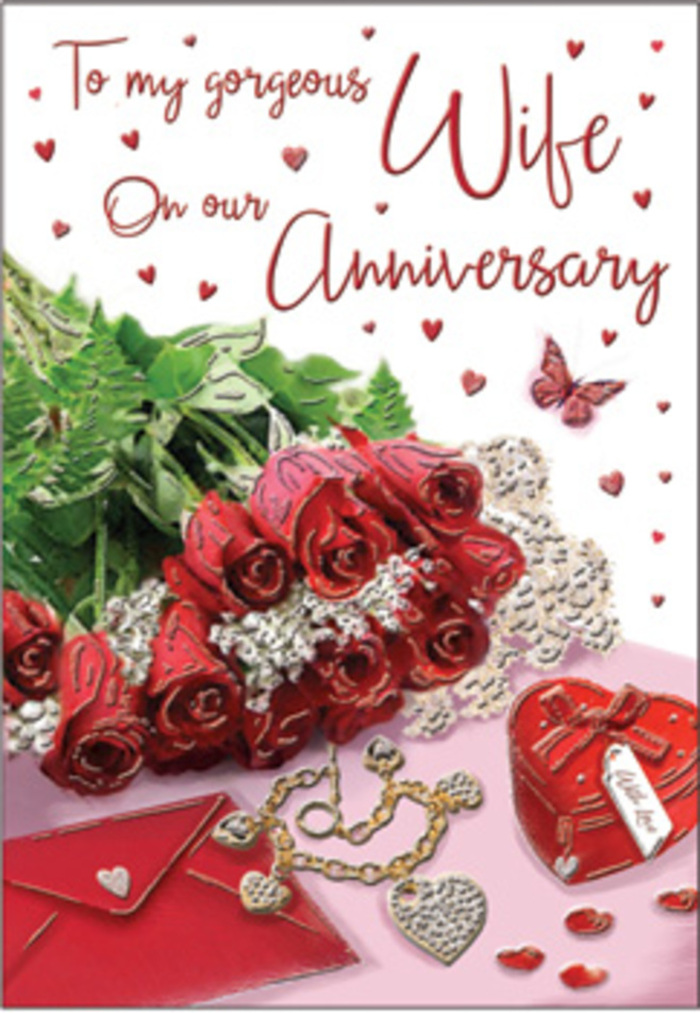 In this richly composed anniversary card image, a classic bouquet of red roses becomes the emotional focal point, much like the centrepiece of a special dinner in a Grove Park home. Each bloom is luxuriously full, petals layered in deep scarlet and crimson tones that suggest devotion that has endured seasons and changes. The roses are elegantly wrapped and cushioned by lush green foliage, their rounded forms and gentle shadows creating a sense of depth and abundance, reminiscent of the tree-lined paths down to the river nearby. Around the bouquet, whisper-thin lace details and delicate heart motifs draw the eye, their intricate patterns softening the scene and adding romance. A coordinating jewellery set and a vivid red box rest nearby, their polished metal and satin finishes glinting under the soft light, suggesting token gifts lovingly chosen for a partner who knows the stories behind each piece. The scripted message on the card is rendered in smooth, flowing handwriting, curling gracefully between the objects as if gently spoken aloud. Velvet, gold, silk, and paper textures all play against one another-the plush depth of the roses, the cool sleekness of jewellery, the smooth envelope surface-forming a tactile tapestry of celebration. Subtle highlights pick out the curves of petals and the edges of each box, while deeper shadows anchor the arrangement, making it feel tangible and present rather than purely decorative. The overall atmosphere is one of intimate romance and gratitude, evocative of anniversaries spent reminiscing and planning the future, with Flowers Grove Park capturing those feelings in an image that honours the beauty of a love that has grown richer over time.