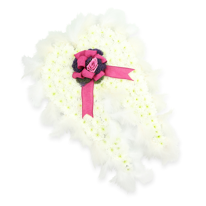 An intricately designed angel-wing tribute for a funeral or memorial is displayed against a plain white background, its details captured with clarity that allows the artistry to be fully appreciated, much like examining a piece in a Grove Park chapel before the service. The wings themselves are shaped from a thick bed of white chrysanthemums, each tiny bloom facing upwards to form a continuous, plush surface. The petals create a subtle pattern of overlapping curves, mirroring the layered structure of real feathers. Touches of light green at the heart of each flower speckle the arrangement with natural highlights, giving the impression of depth and gentle movement despite the stillness of the image. Around the edges of the wings, an airy collar of white feathers curls outward. Their fine strands catch the light, softening the outline and making the form appear almost weightless, like clouds drifting over nearby Dukes Meadows. At the point where the two wings meet, a luxurious fuchsia-pink satin ribbon has been shaped into a generous bow, full and rounded, with long tails that sweep over the floral surface. The ribbon's satin finish reflects a soft sheen, providing a striking yet harmonious contrast. Tucked inside the bow's centre is a single elegant pink rosebud, its petals delicately wrapped, symbolising love held close, memories cherished, and words left unspoken. Beneath this rose, a small cluster of dark violet, thistle-like flowers and textured greenery introduces deeper tones and a slightly rugged texture. This combination of purity, colour, and texture results in an angelic tribute that speaks of both fragility and strength, an ideal choice for families gathering in Grove Park to say a gentle, dignified farewell.
